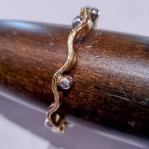 14K yellow gold bangle with white gold balls